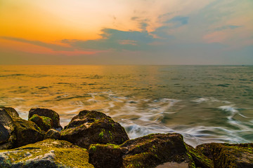storm waves are breaking about the breakwater