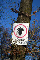 Danger - Ticks (UKR). Tick insect meningitis warning sign in nature . Lyme disease and tick-borne...