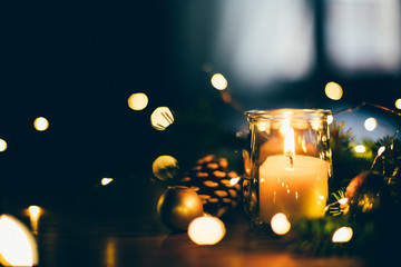 Fototapeta na wymiar Christmas mood at home with candle and lights