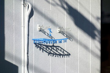 Exterior wall and clothespin background                  
