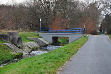 bridge over a stream in a park