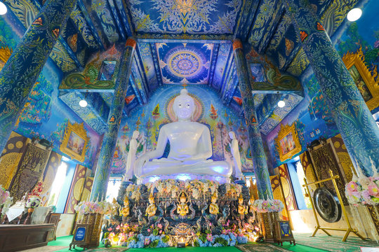 The beautiful white buddha in blue church at Wat Rong Suea Ten, Chaing rai, Thailand
