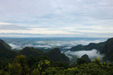Naklejka premium Beautiful mountain panoramic landscape and fog in the morning with blue sky