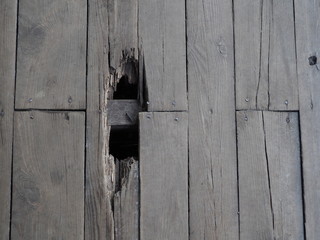 old floor of wooden boards with swirls