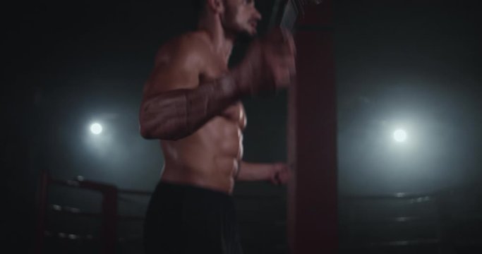Details jumping guy over the rope in a cross fitness class perfect body full of hard muscle