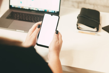 girl holds phone in hand