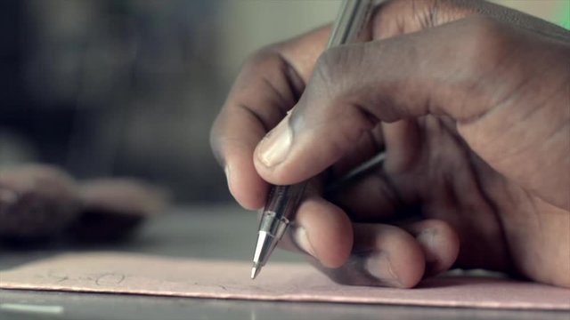 Signing an envelope that will be mailed to a job opportunity