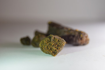 A medical marijuana plant extract. Cannabis flower extract. Weed concentrate. THC concentrate. Cannabis wax. Bubble hash
