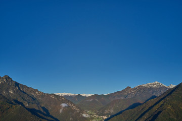 Panoramic view of the mountains in the background clear blue sky. Snow on the top of the mountain.