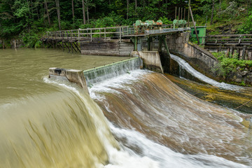 Weir on the river Schwarza in Hirschwang on a cloudy day in summer