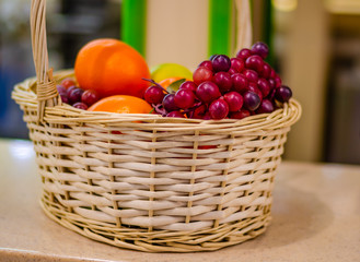 Straw basket with fruits and vegetables.