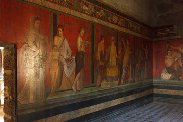 Fototapeta na wymiar Fresco covers walls of villa of the mysteries in Pompeii (Pompei).