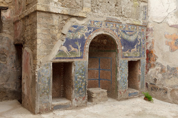 Fototapeta na wymiar Nymphaeum decorated with mosaics House of the Neptune Mosaic in Ancient Ercolano (Herculaneum) city ruins.