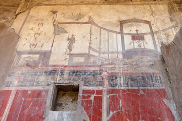 Fototapeta na wymiar Fresco on the wall in Ancient Ercolano (Herculaneum) city ruins.