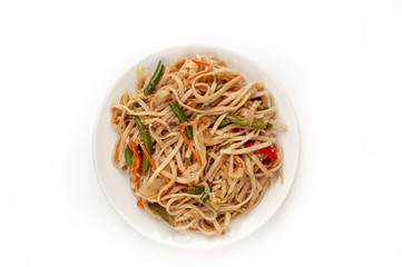 Asian vegetarian food udon noodles with Beijing cabbage, carrots, green beans, sweet pepper, onions...