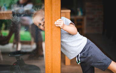 Portrait of little boy during playing on home patio