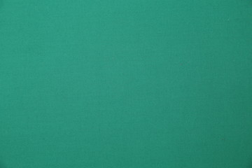 green fabric background with copy space for your text. Turquoise color. seamless pattern. Color empty background.