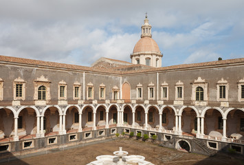 Fototapeta na wymiar Courtyard of Benedictine Monastery of San Nicolo l'Arena.