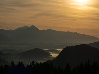 View on the beautiful sunrise over the majestic hills with the Lake Bled in Slovenia