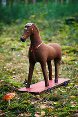 rocking horse on the grass with mushroom