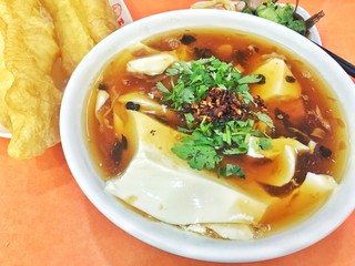 Tofu and Fried dough sticks on the table.