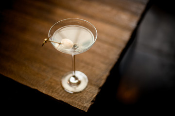 Close-up of cocktail with quail egg on toothpick