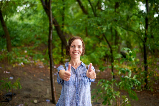 Drenched Woman In The Rain Forest In Summer