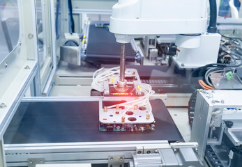 automatic robot with vacuum suckers and conveyor in Production of candy in a manufacture factory...