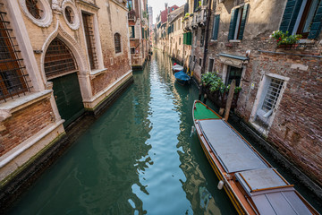 Fototapeta na wymiar Venice canal with venetian boats in Venice, Italy