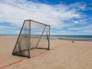 football goal on beach with sea background - 306731792