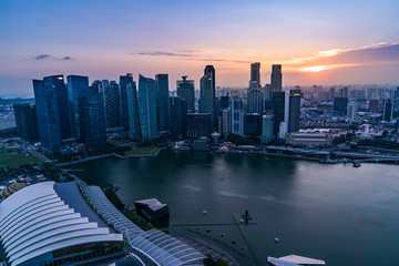 Naklejka na ściany i meble Singapore financial district skyline in beautiful sunset, Singapore city