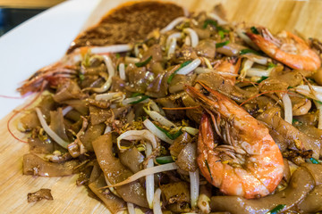 Close up Singaporean style stir fried noodle with bean sprout and shrimp