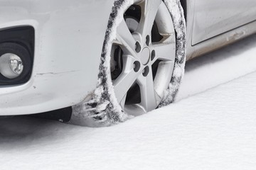 Wheels of a car in fresh snow
