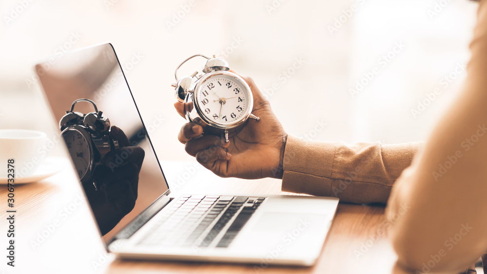Aufkleber unrecognizable afro guy checking time on his clock