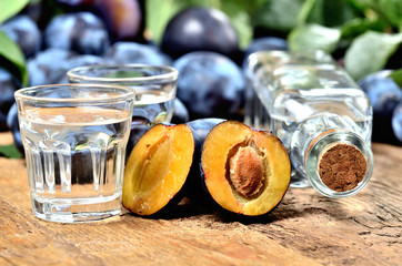 Fresh plums and shots of Slivovice, typical Eastern Europe alcohol plum brandy.