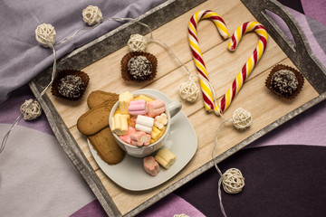 tray with sweets in the morning bed