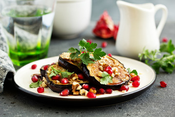 Fried eggplants with pomegranate sauce and nuts.
