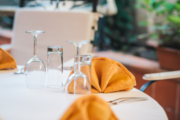 Table set up with cloth napkins. Formal dinner. Restaurant table