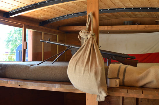 Interior of Legionnaire train from the First World War, with machine gun on bed and old Czechoslovakia flag - Powered by Adobe