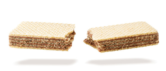 Waffle stick broken in half flying in the air on a white. Isolated
