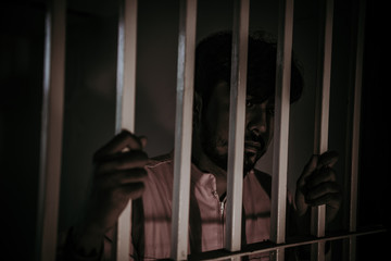 Hands of men desperate to catch the iron prison,prisoner concept,thailand people,Hope to be free.