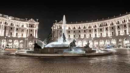 Fototapeta premium The Fountain of the Naiads and the Republic square in Rome at night.