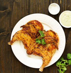 Tapak roast chicken with vegetables and peanut sauce. Shooting from above.