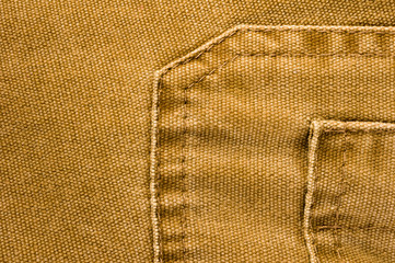 clothing items stonewashed cotton fabric texture with seams, clasps, buttons and rivets, macro