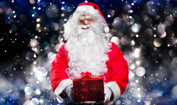 Santa Claus holding a present