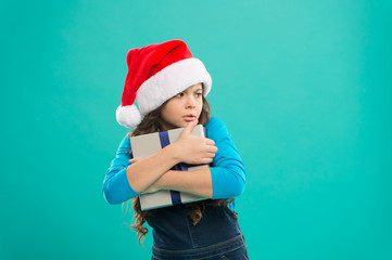 I will not give it to anyone. Shopping online. Winter sale. Child hug gift. Happy new year. All about sharing and caring. Packaging for gift. Small girl hold gift box. Greedy baby hold package tight