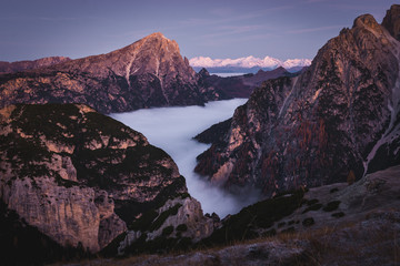 Dolomites, Italy, autumn sunrise valley landscape with cloud inversion
