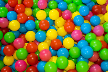 Plastic balls for children of different colors and the same size.