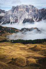 Dreamlike beautiful valley in Dolomites Italy witch cloud inversion