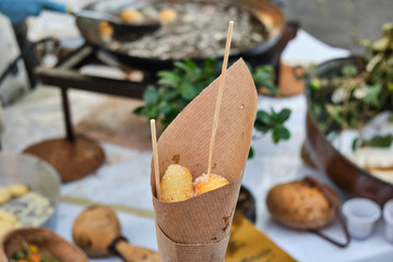 Arrubiolus, sardinian sweet or salad finger food, made by fried seada cheese